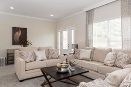 The KENNESAW ELITE Living Room. This Manufactured Mobile Home features 4 bedrooms and 2 baths.