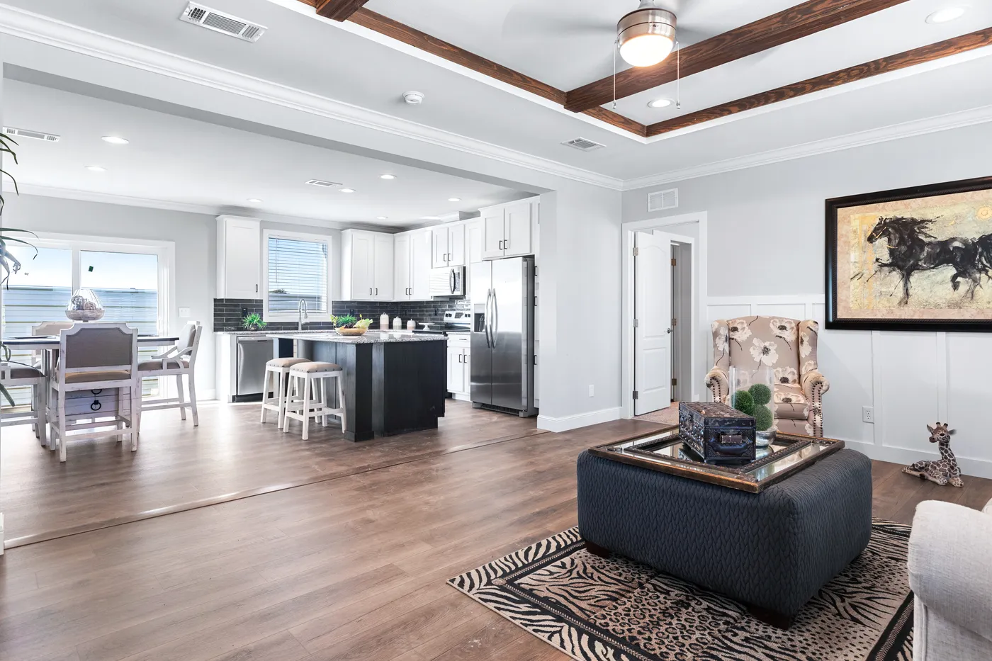 The THE FUJI Living Room. This Manufactured Mobile Home features 4 bedrooms and 3 baths.