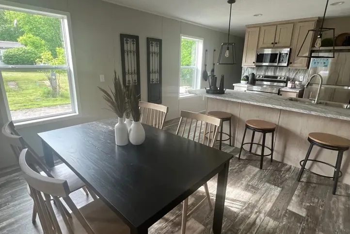 The JADE Dining Area. This Manufactured Mobile Home features 2 bedrooms and 1 bath.