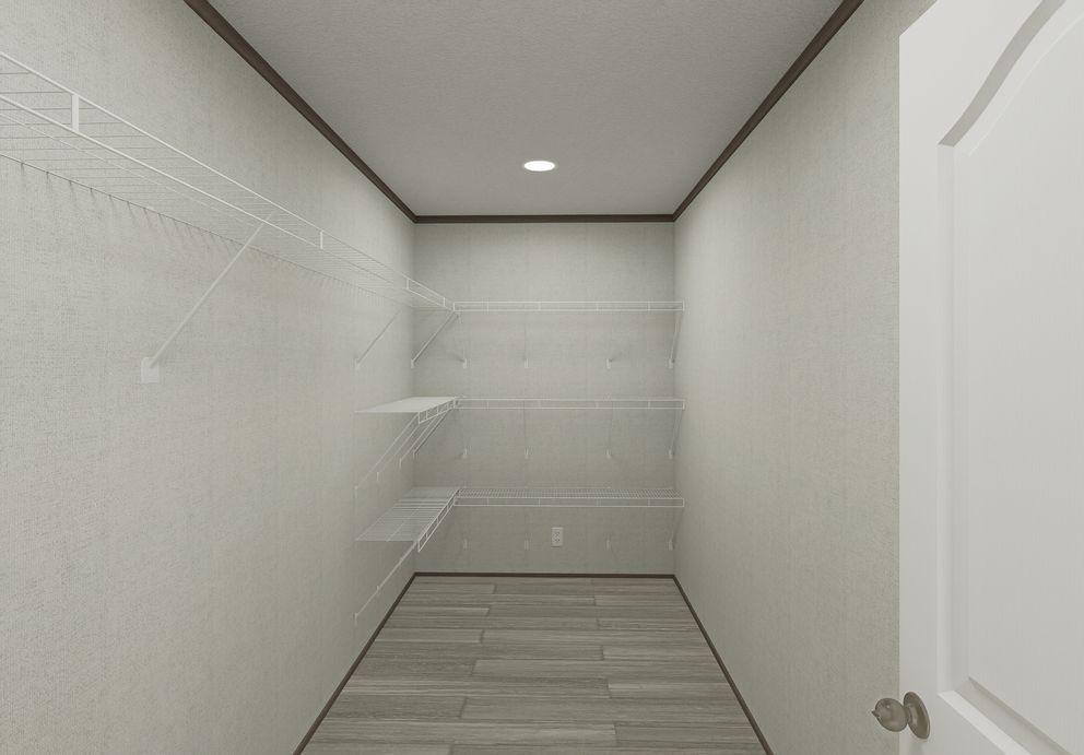 The THE MOUNTAINEER 64 Utility Room. This Manufactured Mobile Home features 3 bedrooms and 2 baths.