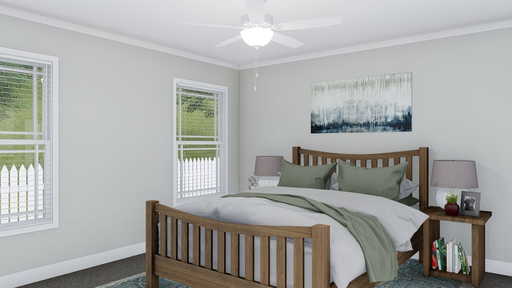 The THE BREEZE Primary Bedroom. This Manufactured Mobile Home features 3 bedrooms and 2 baths.