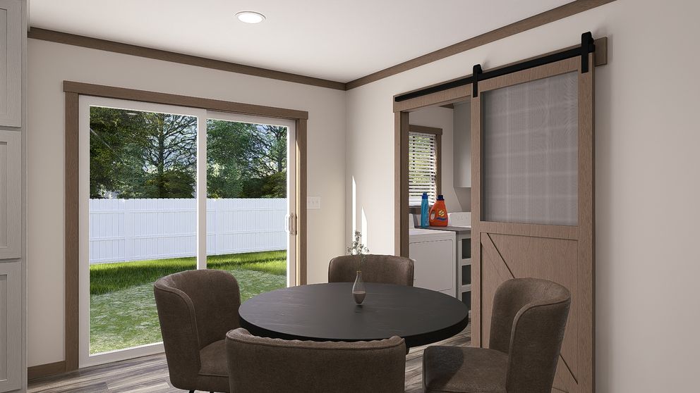 The SAWYER ELITE Dining Area. This Manufactured Mobile Home features 3 bedrooms and 2 baths.
