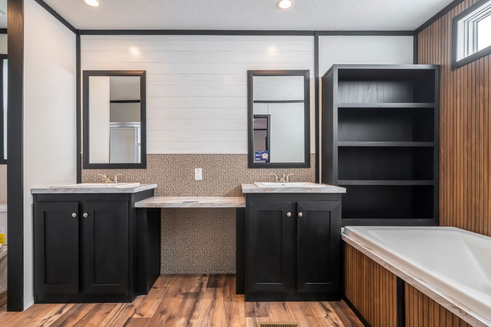 The RAVENWOOD Primary Bathroom. This Manufactured Mobile Home features 3 bedrooms and 2 baths.