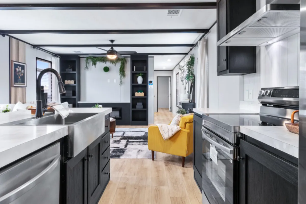 The ANNIVERSARY 16763S Kitchen. This Manufactured Mobile Home features 3 bedrooms and 2 baths.