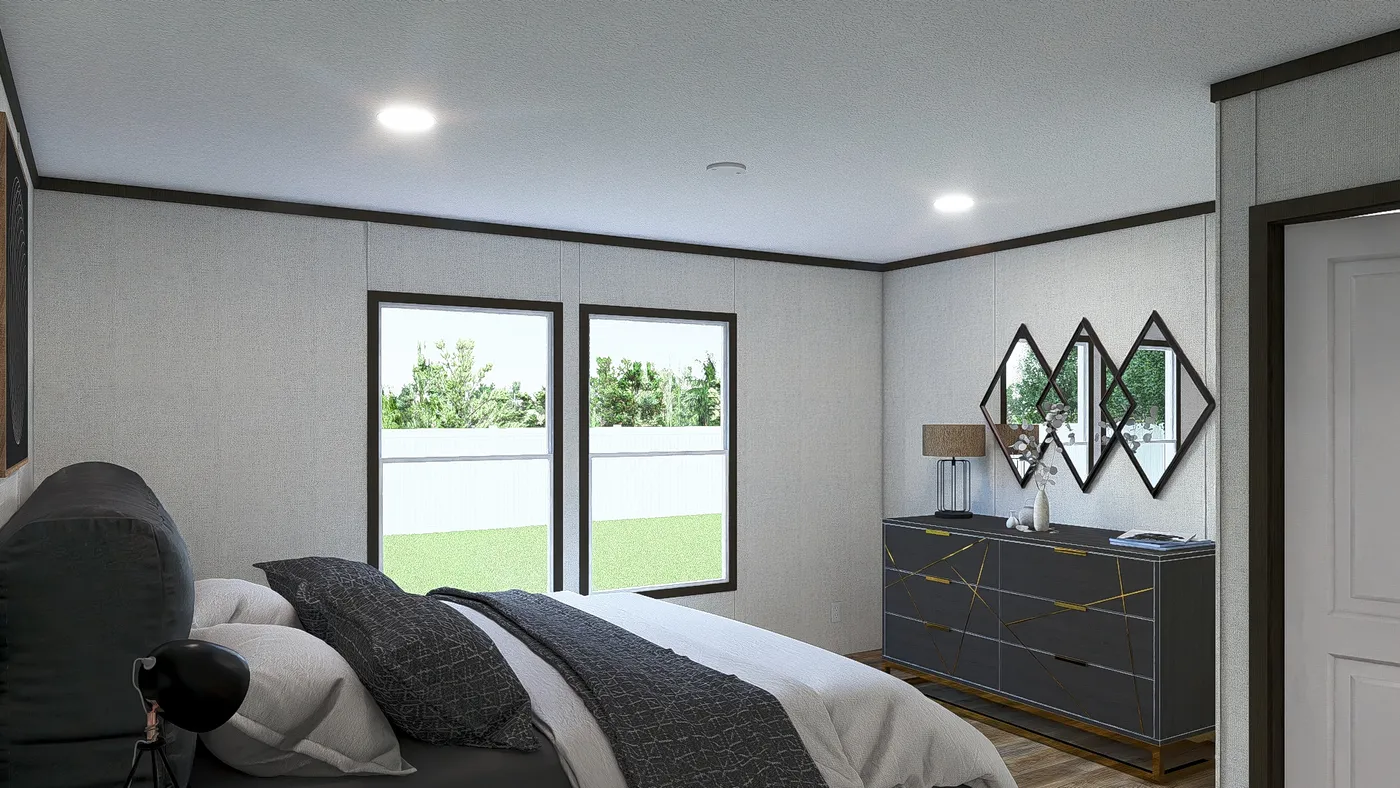 The DISCOVER Primary Bedroom. This Manufactured Mobile Home features 3 bedrooms and 2 baths.