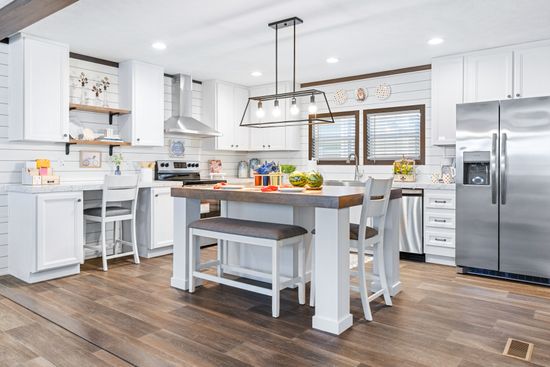The BREEZE FARMHOUSE 72 Kitchen. This Manufactured Mobile Home features 4 bedrooms and 2 baths.