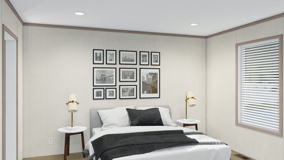 The 5628-E786 THE PULSE Primary Bedroom. This Manufactured Mobile Home features 3 bedrooms and 2 baths.