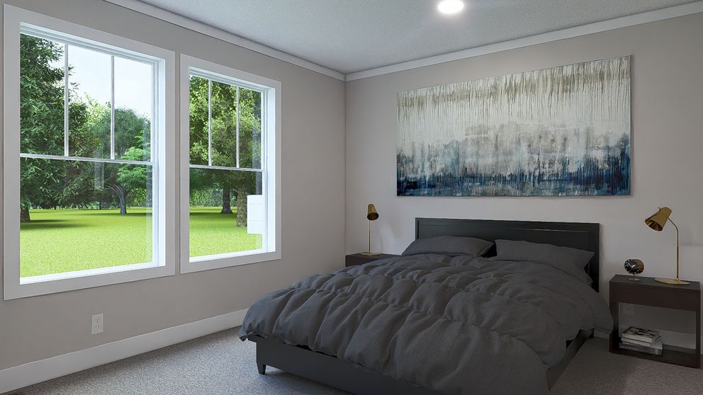 The MY GIRL Primary Bedroom. This Manufactured Mobile Home features 3 bedrooms and 2 baths.