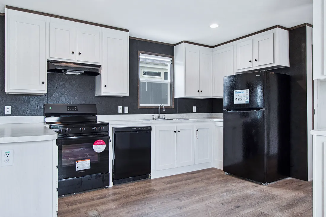 The HOMESTEAD 16562A Kitchen. This Manufactured Mobile Home features 2 bedrooms and 2 baths.