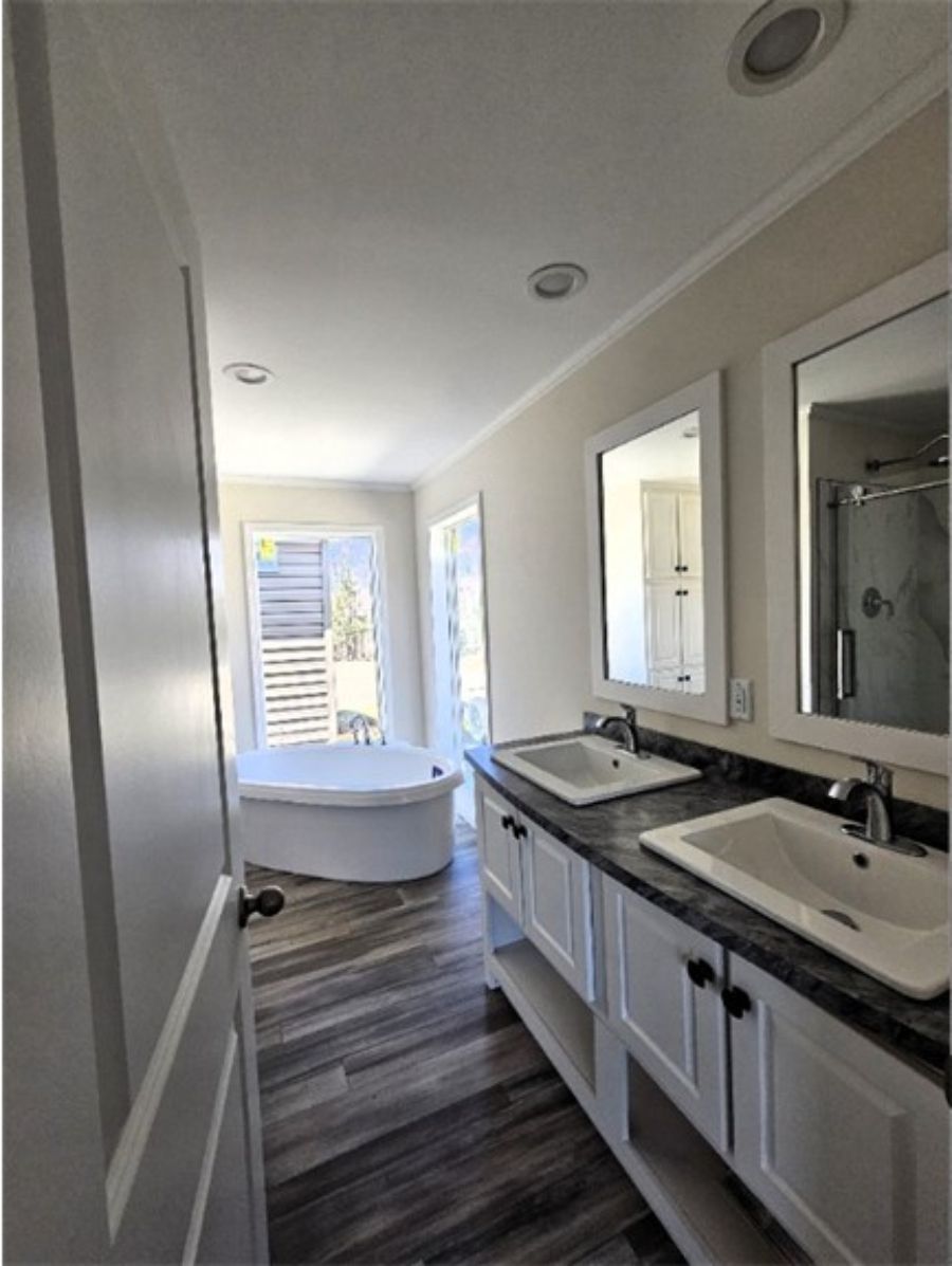 The SPINEL 64 Primary Bathroom. This Manufactured Mobile Home features 3 bedrooms and 2 baths.