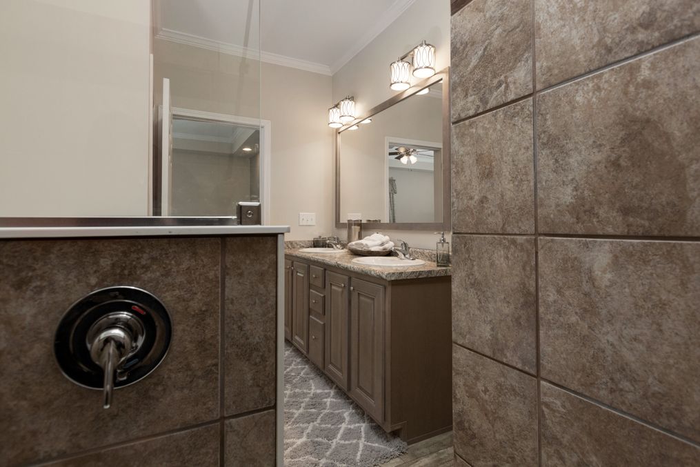 The KENNESAW ELITE Primary Bathroom. This Manufactured Mobile Home features 4 bedrooms and 2 baths.