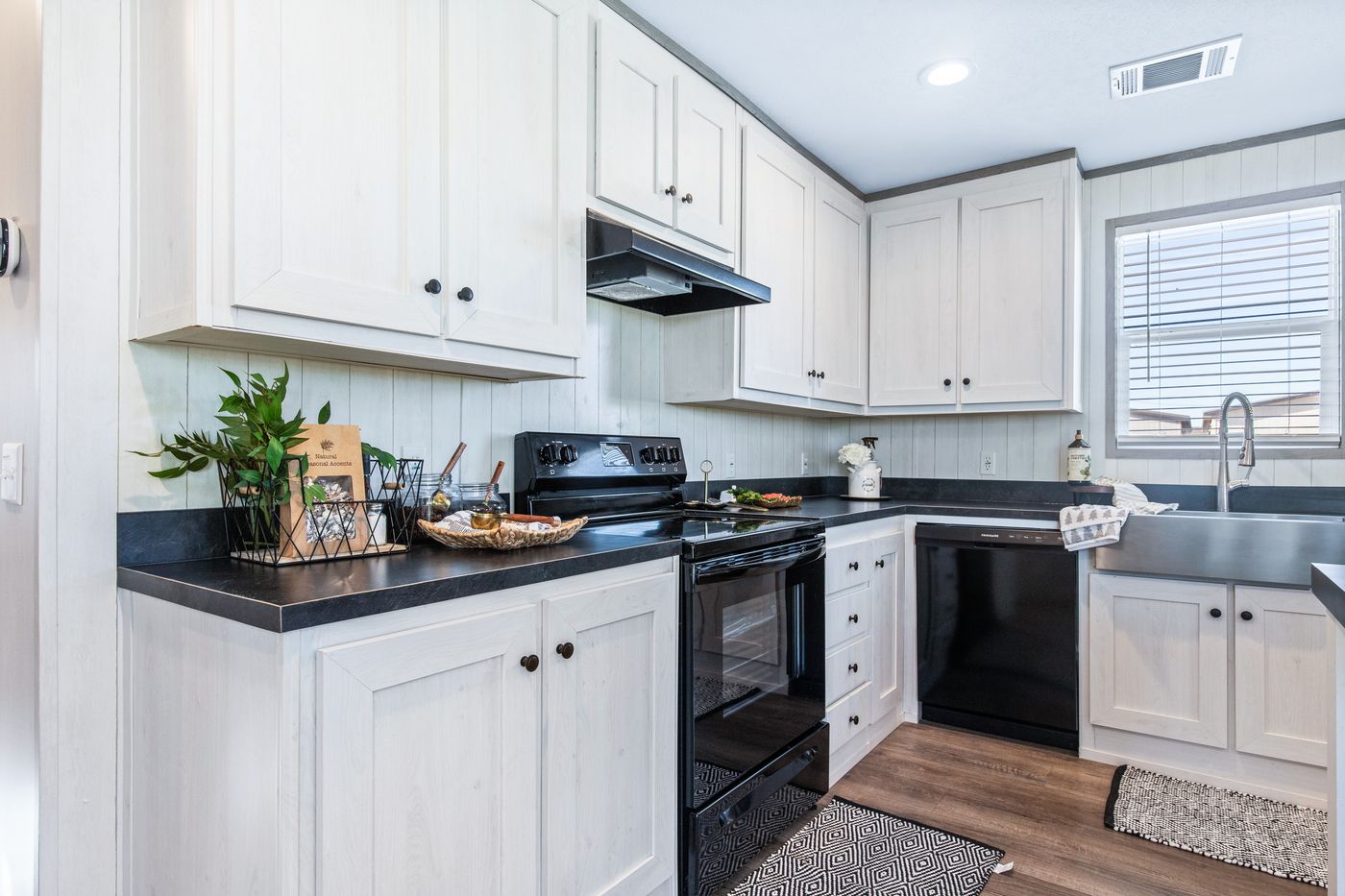 The PORCH LIVING SERIES 16682A Kitchen. This Manufactured Mobile Home features 2 bedrooms and 2 baths.