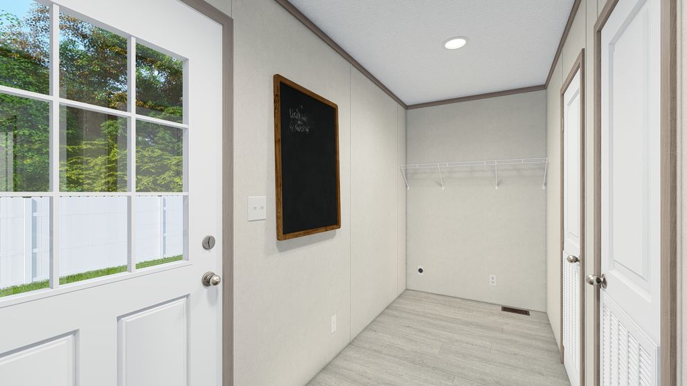 The 5628-E786 THE PULSE Utility Room. This Manufactured Mobile Home features 3 bedrooms and 2 baths.