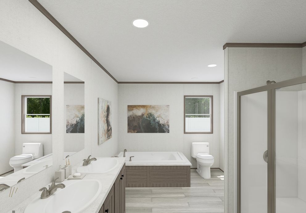 The THE MOUNTAINEER 64 Primary Bathroom. This Manufactured Mobile Home features 3 bedrooms and 2 baths.