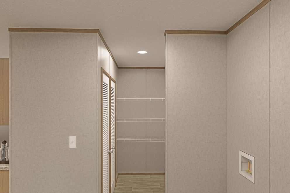 The THE EAGLE 52 Utility Room. This Manufactured Mobile Home features 3 bedrooms and 2 baths.