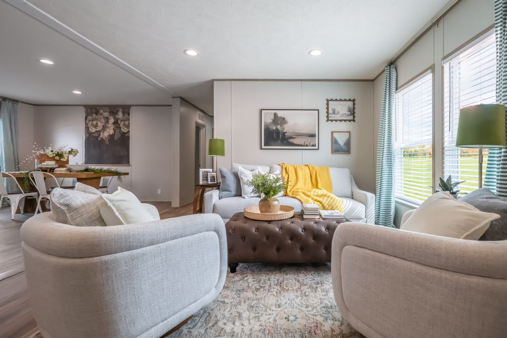The VISTA Living Room. This Manufactured Mobile Home features 3 bedrooms and 2 baths.