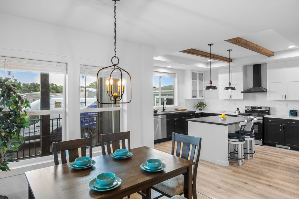 The LULAMAE 3 Dining Room. This Manufactured Mobile Home features 3 bedrooms and 2 baths.