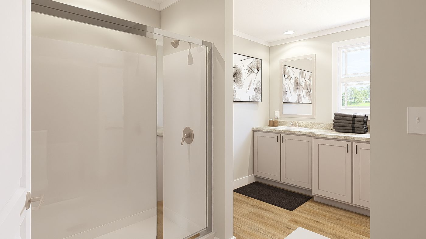 The THE BREEZE 64 Primary Bathroom. This Manufactured Mobile Home features 4 bedrooms and 2 baths.