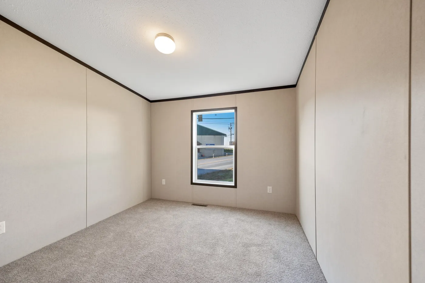 The GARNET Guest Bedroom. This Manufactured Mobile Home features 3 bedrooms and 2 baths.