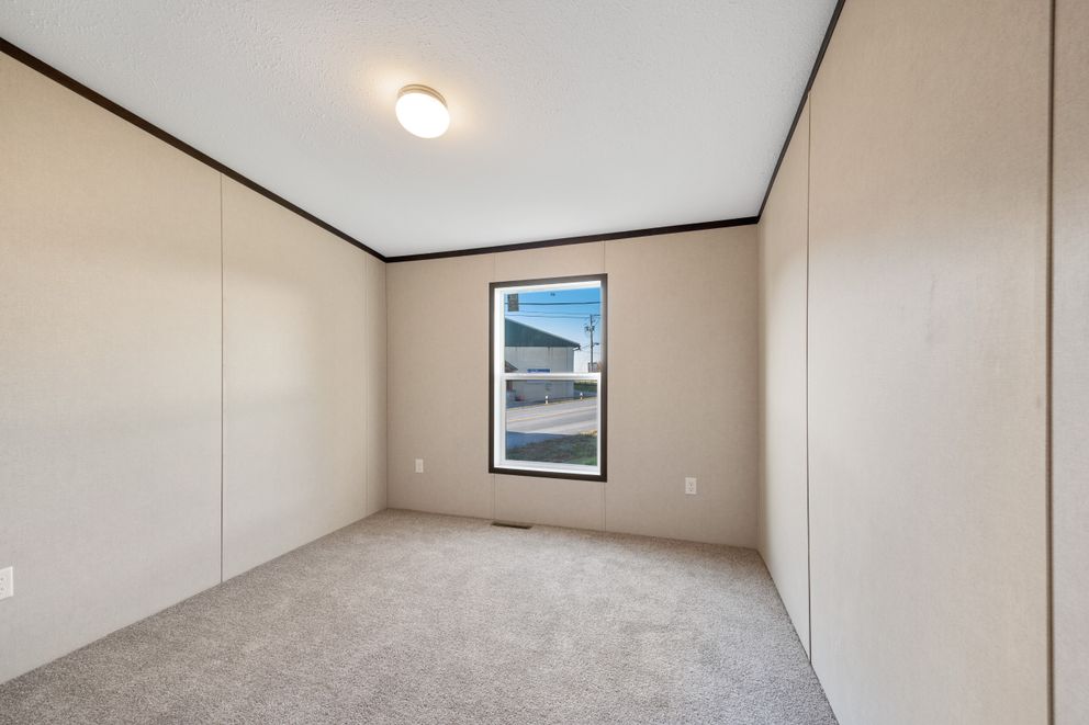 The GARNET Guest Bedroom. This Manufactured Mobile Home features 3 bedrooms and 2 baths.