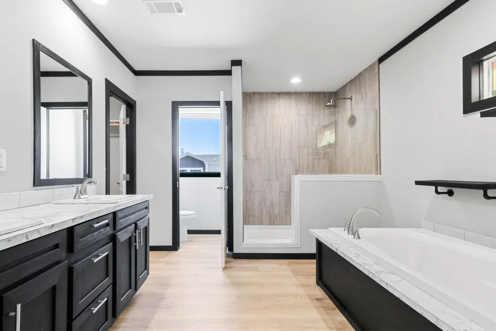 The THE ARMANI Primary Bathroom. This Manufactured Mobile Home features 3 bedrooms and 2 baths.