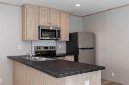 The BLAZER 48 A Kitchen. This Manufactured Mobile Home features 2 bedrooms and 1 bath.