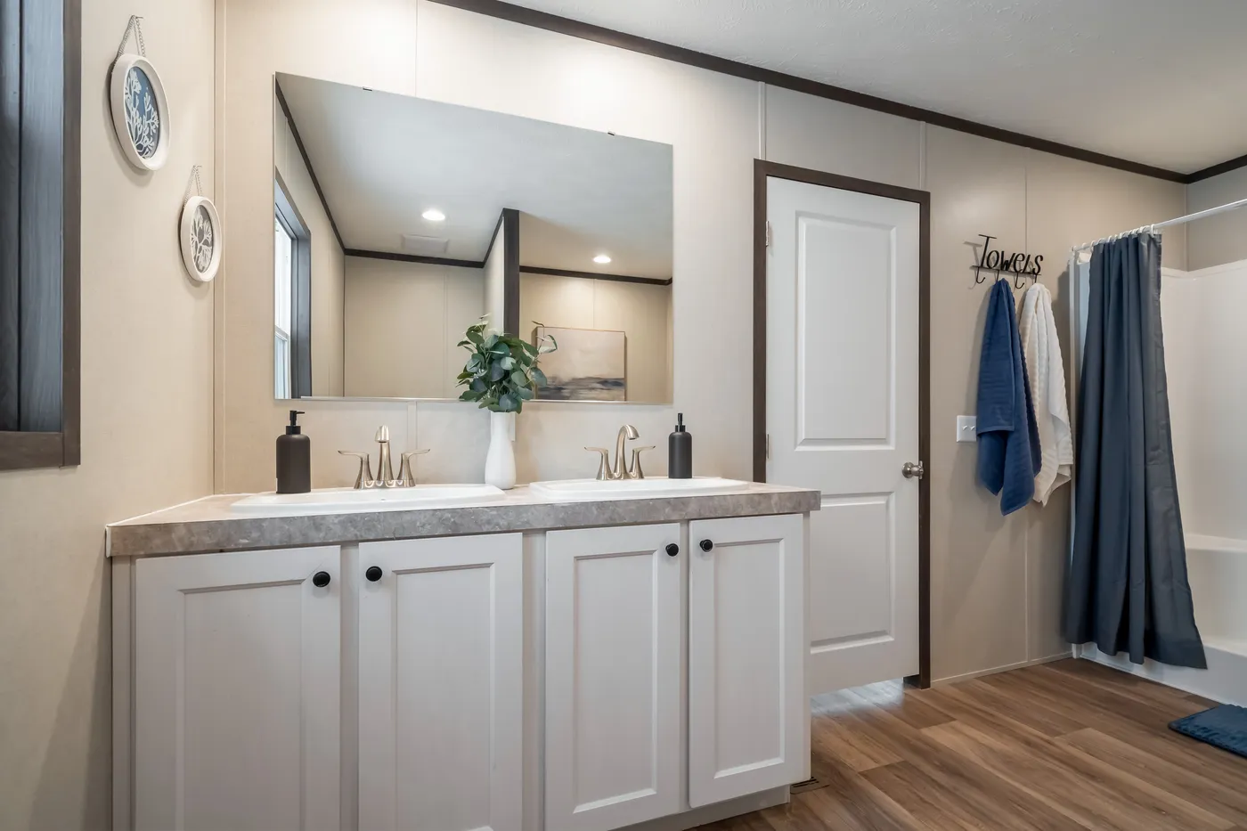 The DYNAMIC Primary Bathroom. This Manufactured Mobile Home features 3 bedrooms and 2 baths.