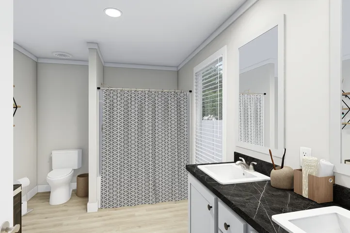 The CLASSIC 56D Primary Bathroom. This Manufactured Mobile Home features 3 bedrooms and 2 baths.