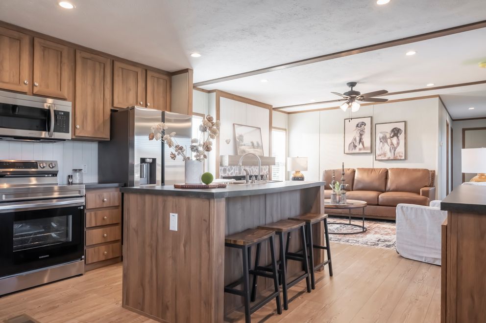 The SEAS THE DAY Kitchen. This Manufactured Mobile Home features 3 bedrooms and 2 baths.