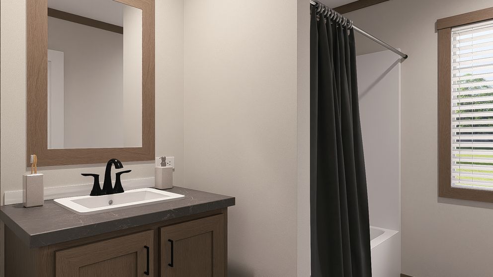 The NELLIE Guest Bathroom. This Manufactured Mobile Home features 4 bedrooms and 2 baths.