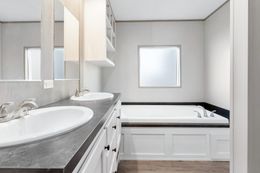 The ANNIVERSARY 16682A Primary Bathroom. This Manufactured Mobile Home features 2 bedrooms and 2 baths.