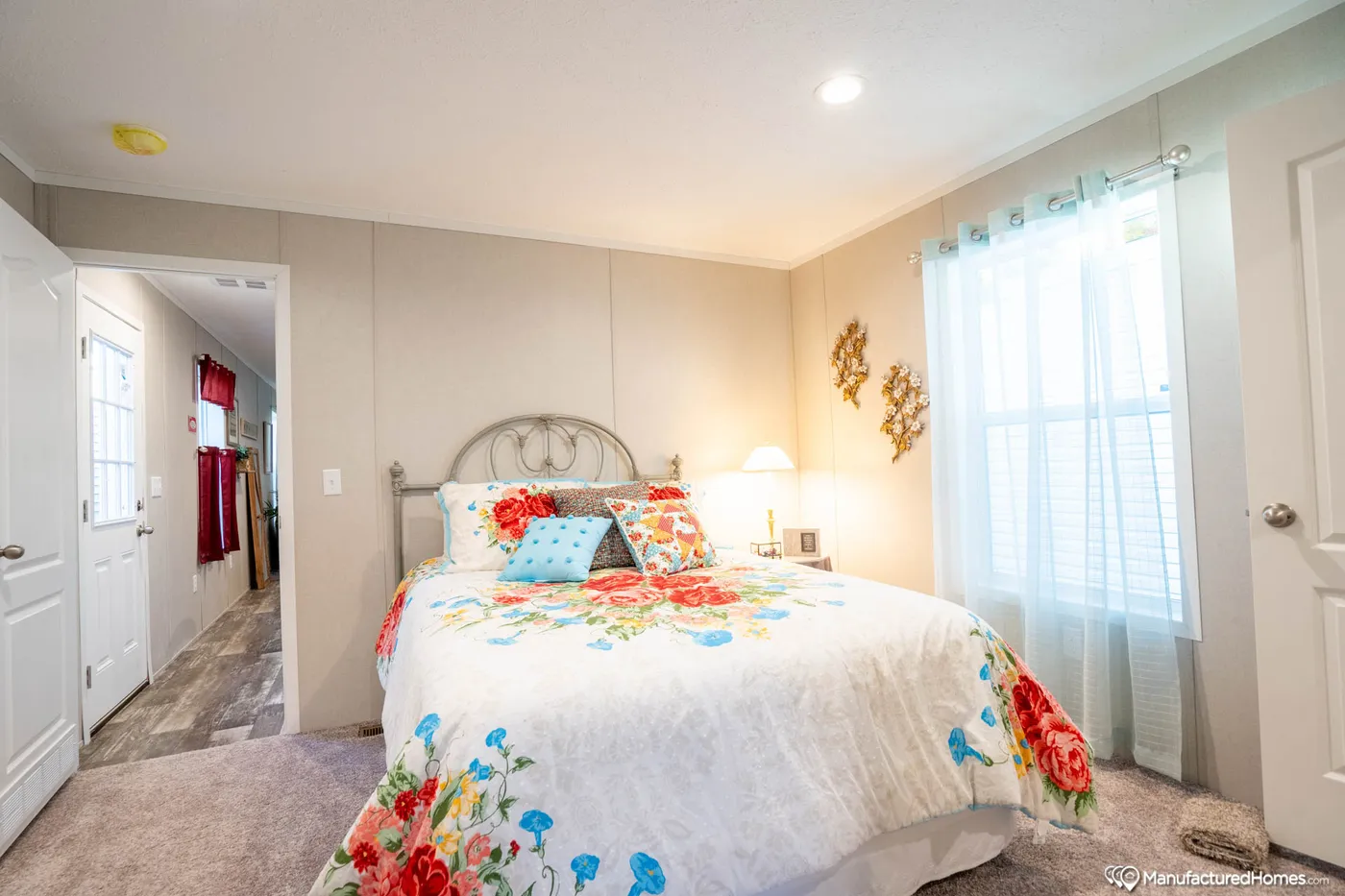 The TOPAZ 70 Primary Bedroom. This Manufactured Mobile Home features 3 bedrooms and 2 baths.