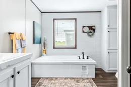 The ABSOLUTE VALUE Primary Bathroom. This Manufactured Mobile Home features 4 bedrooms and 2 baths.