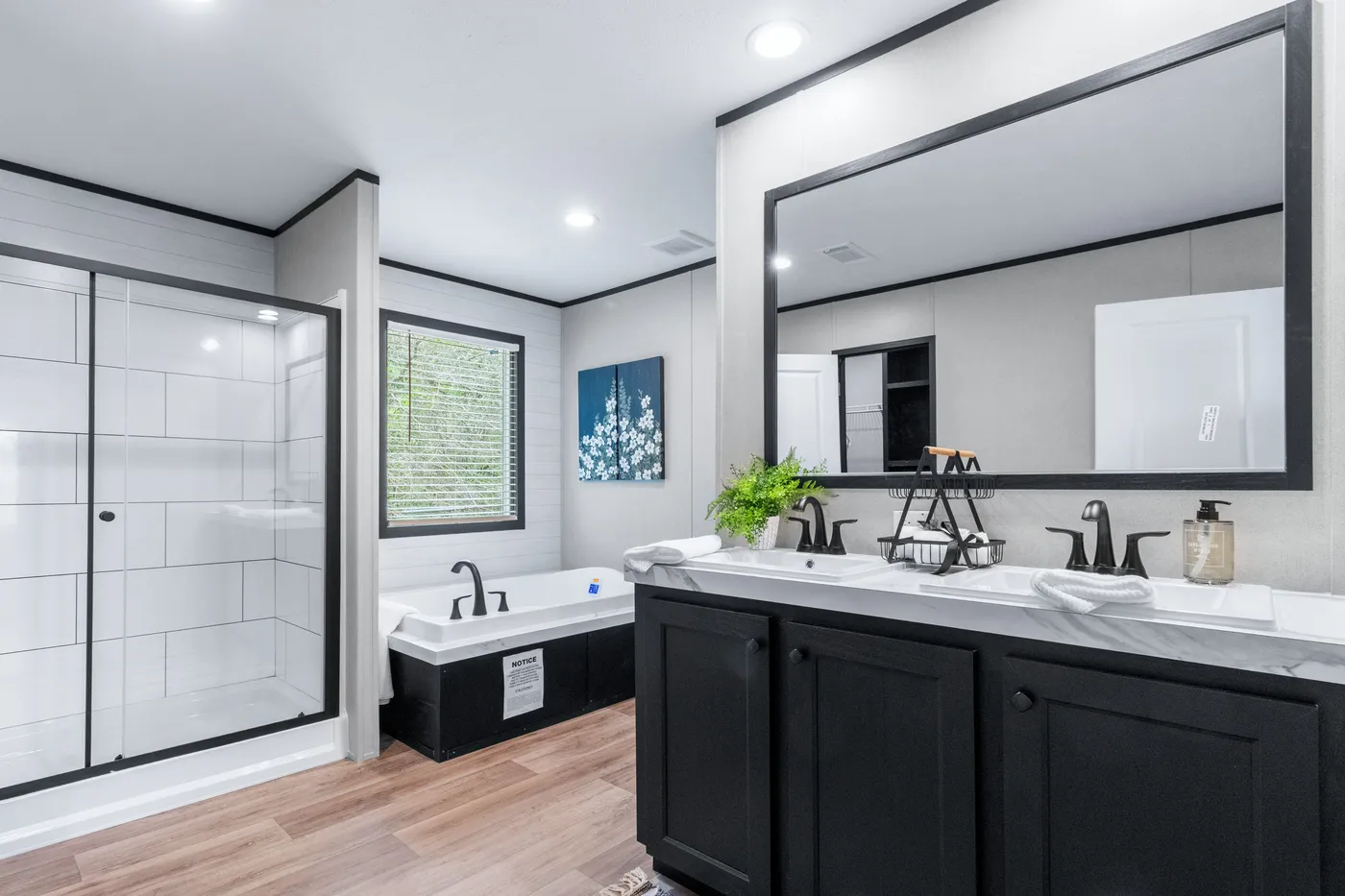The ABSOLUTE VALUE Primary Bathroom. This Manufactured Mobile Home features 4 bedrooms and 2 baths.