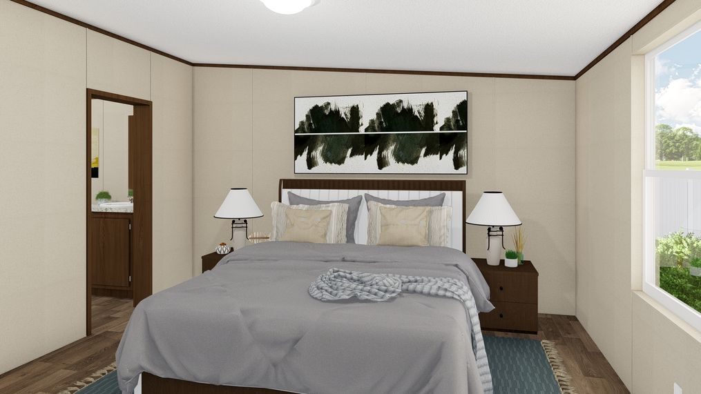The SATISFACTION Primary Bedroom. This Manufactured Mobile Home features 3 bedrooms and 2 baths.