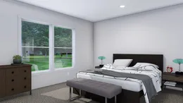 The LOVELY DAY Primary Bedroom. This Modular Home features 4 bedrooms and 2 baths.