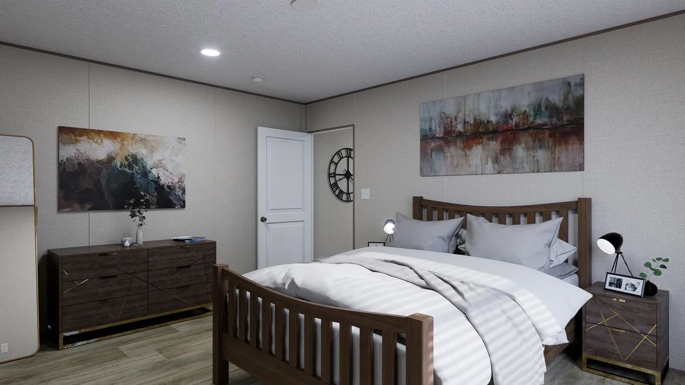 The FOOTHILLS 76 Primary Bedroom. This Manufactured Mobile Home features 3 bedrooms and 2 baths.