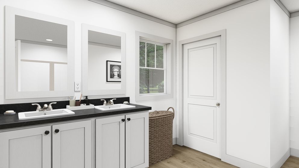 The WONDERFUL WORLD Primary Bathroom. This Manufactured Mobile Home features 3 bedrooms and 2 baths.