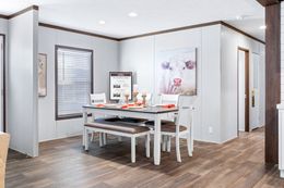 The BREEZE FARMHOUSE 72 Dining Area. This Manufactured Mobile Home features 4 bedrooms and 2 baths.