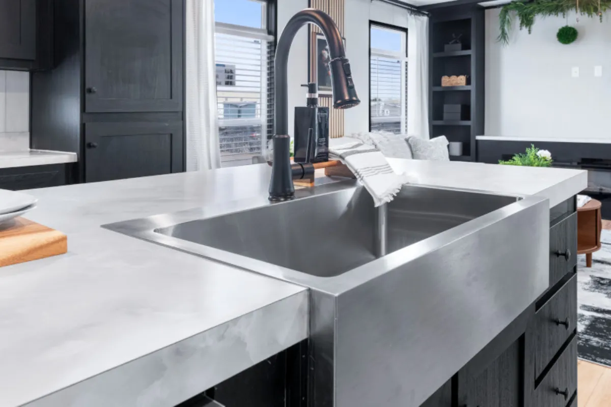 The ANNIVERSARY 16763S Kitchen. This Manufactured Mobile Home features 3 bedrooms and 2 baths.