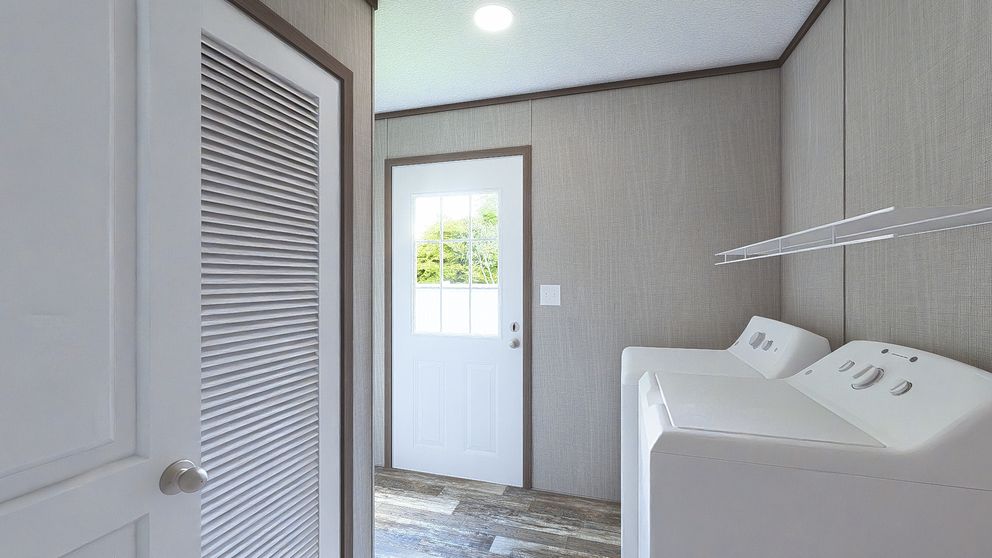 The ULTRA BREEZE 28X52 Utility Room. This Manufactured Mobile Home features 3 bedrooms and 2 baths.