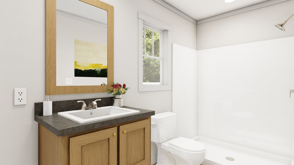 The WALK THE LINE Primary Bathroom. This Manufactured Mobile Home features 3 bedrooms and 2 baths.