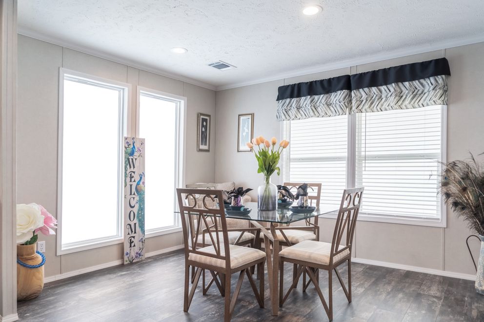 The ALL AMERICAN Dining Room. This Manufactured Mobile Home features 3 bedrooms and 2 baths.