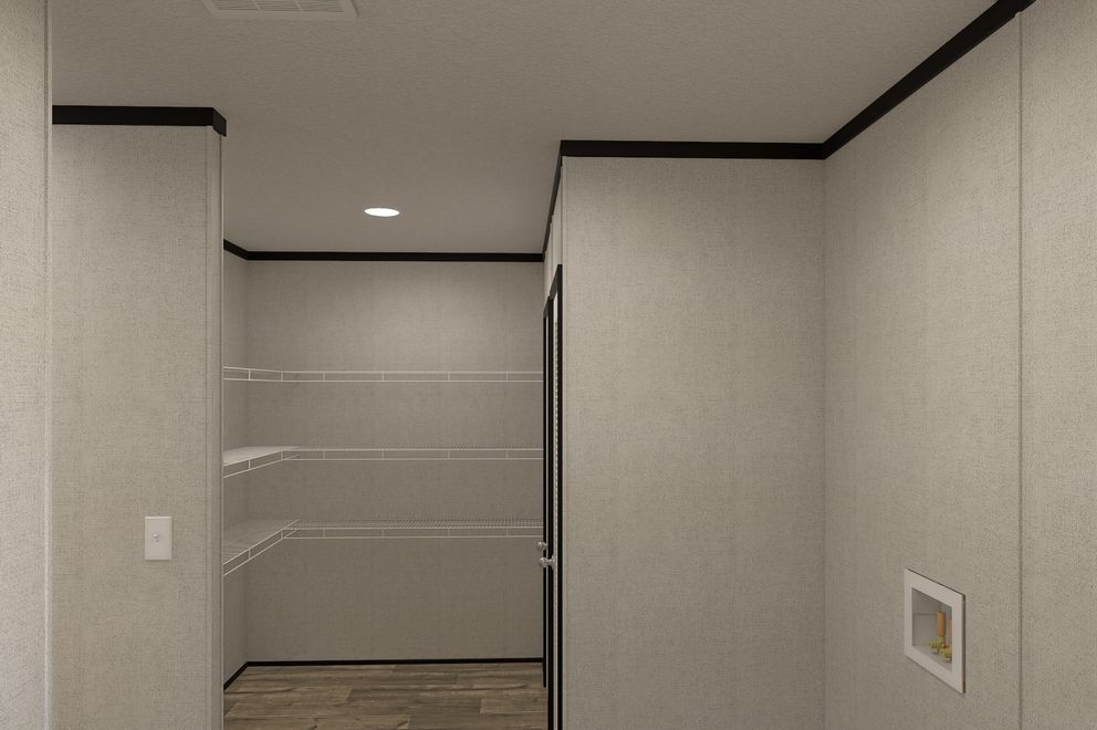 The THE MOUNTAINEER 48 Utility Room. This Manufactured Mobile Home features 3 bedrooms and 2 baths.