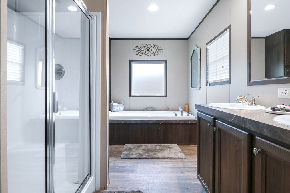 The THE REAL DEAL Primary Bathroom. This Manufactured Mobile Home features 3 bedrooms and 2 baths.