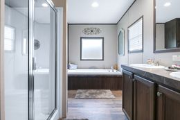 The THE REAL DEAL Primary Bathroom. This Manufactured Mobile Home features 3 bedrooms and 2 baths.