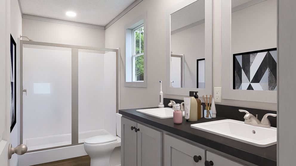 The JOHNNY B GOODE Primary Bathroom. This Modular Home features 3 bedrooms and 2 baths.