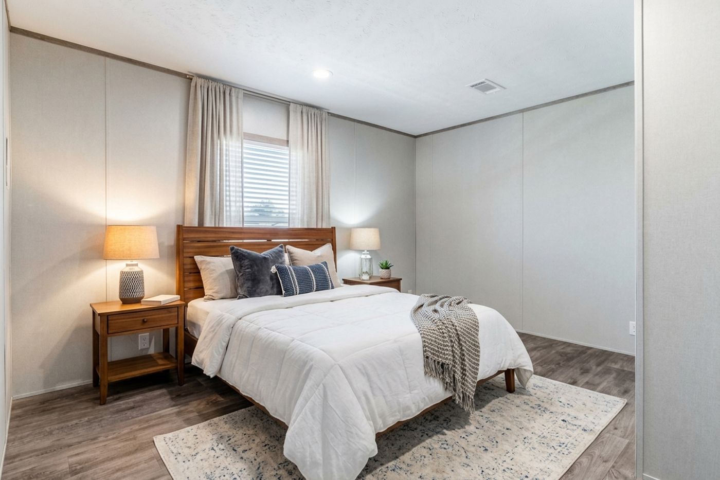The THE BIG DEAL 52 Primary Bedroom. This Manufactured Mobile Home features 3 bedrooms and 2 baths.