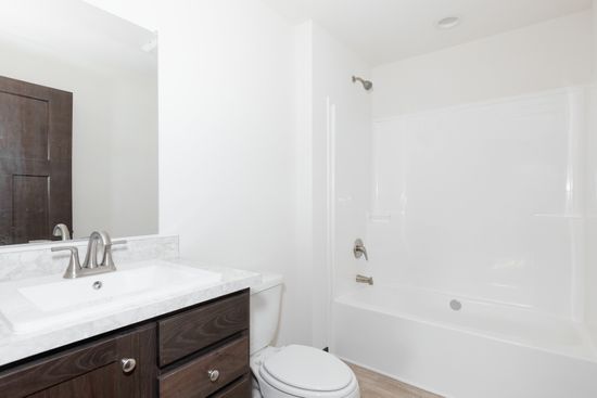 The TOMPKINS BLVD 6428-MS029 SECT Guest Bathroom. This Manufactured Mobile Home features 3 bedrooms and 2 baths.