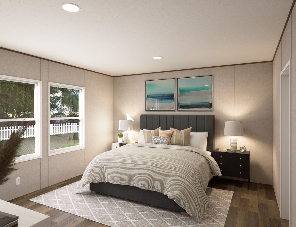 The OAK Primary Bedroom. This Manufactured Mobile Home features 4 bedrooms and 2 baths.